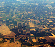 Aerial view of the Central Valley, showing agricultural fields and housing developments.